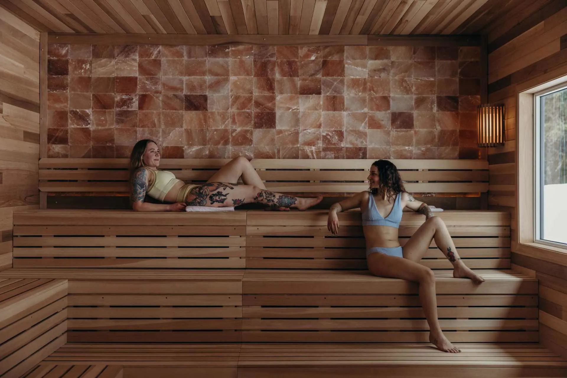 Two women iin Alyeska Resort Signature Sauna